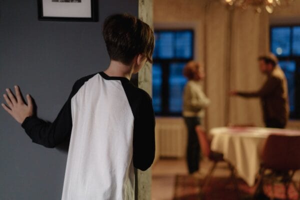 a boy watching her parents quarrel